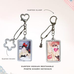 May include: Two custom photo charm keychains. One features a heart-shaped clasp and a star-shaped charm, the other a guitar charm. Both have rectangular photo inserts. Text on the image reads: "CUSTOM CLASP", "CUSTOM CHARM", "CUSTOM MEDIUM RECTANGLE PHOTO CHARM KEYCHAIN", and "lucky dream".