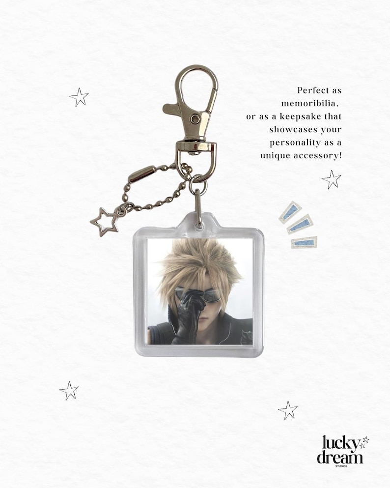 May include: A square acrylic keychain featuring a character with spiky blonde hair and dark sunglasses. The keychain includes a silver-toned metal lobster clasp and a small chain with a star-shaped charm. Text on the image reads: Perfect as memorabilia, or as a keepsake that showcases your personality as a unique accessory! and lucky dream studios.