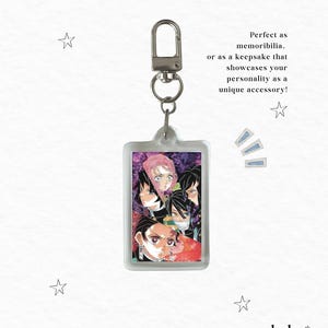 May include: A rectangular keychain featuring a colorful anime-style illustration of several characters. The keychain has a silver-colored clasp and a ring. The text on the image says, "Perfect as memorabilia, or as a keepsake that showcases your personality as a unique accessory!"