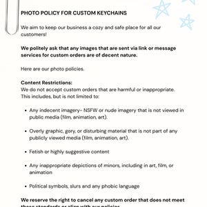 May include: A white document with the text "PHOTO POLICY FOR CUSTOM KEYCHAINS" and content restrictions. A silver paperclip is in the upper left corner. The background is light blue with white star shapes.