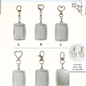 May include: Six clear rectangular acrylic keychain frames labeled A through F, each featuring a different silver-tone metal clasp style. The text Custom Clasps is at the top, and a circular inset shows two frames with additional charm chains attached.