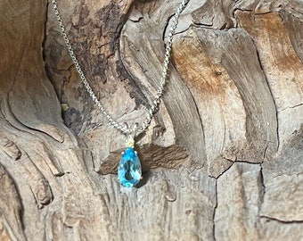 Custom Blue Topaz Pendant Features a Diamond Wrapped in Sterling Silver 925