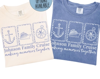 May include: Two t-shirts, one cream and one blue, with a cruise theme. Each shirt features three framed images: an anchor, a cruise ship, and a compass. The text reads "Johnson Family Cruise 2026 making memories together."