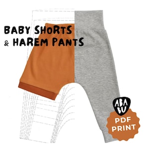 Op de afbeelding: Afbeelding van baby shorts en harembroeken. De shorts zijn oranje met een geribbelde textuur en donkerdere rand. De harembroek is grijs. Tekst luidt "BABY SHORTS & HAREM PANTS" en "PDF PRINT".