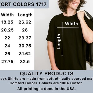 May include: Black Comfort Colors 1717 t-shirt. The image shows the width and length measurements for sizes S to 3XL. The shirt is made of 100% cotton and is printed in the USA. The shirt is shown on a person.