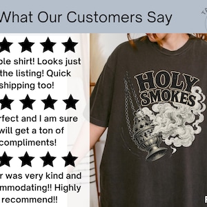May include: Dark gray t-shirt featuring a graphic of a censer with smoke and the words "HOLY SMOKES". The shirt also has customer reviews and a logo.