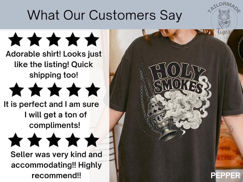 May include: Dark gray t-shirt featuring a graphic of a censer with smoke and the words "HOLY SMOKES". The shirt also has customer reviews and a logo.