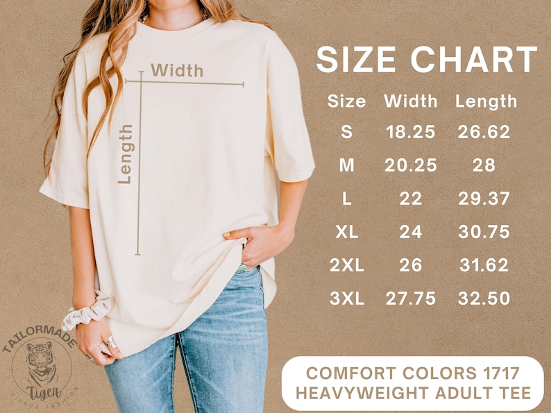 May include: Cream-coloured heavyweight adult tee shirt with a size chart. The chart lists sizes S through 3XL, with width measurements from 46.35 to 70.49 cm and lengths from 67.62 to 82.55 cm. The shirt is labeled "Comfort Colors 1717".
