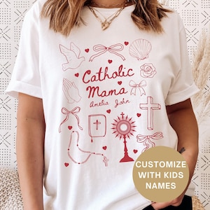 Celebrate faith and motherhood with this personalized Catholic mom sweatshirt! Featuring a doodle aesthetic, this cozy faith-inspired tee is perfect for Catholic Mamas, homeschool moms, adoration hour or everyday wear. A perfect Mothers Day Gift for Mom or Grandma. A custom Christian gift she'll cherish!