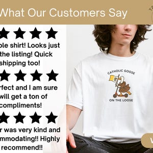 May include: White t-shirt featuring a cartoon goose riding a scooter, holding a flag with a shamrock and the text "Catholic Goose On The Loose." The shirt has a crew neck and short sleeves. The word "WHITE" is at the bottom.