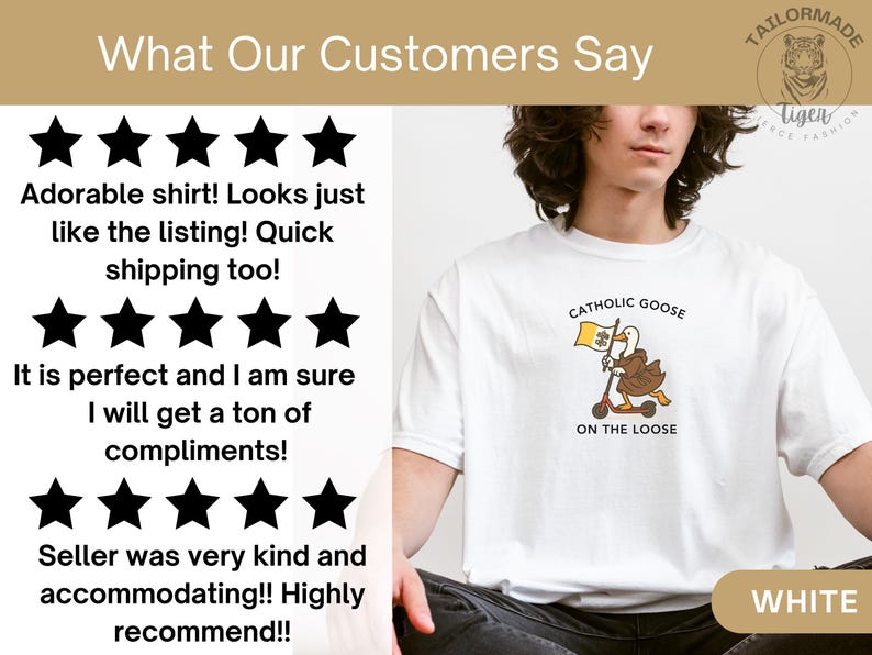 May include: White t-shirt featuring a cartoon goose riding a scooter, holding a flag with a shamrock and the text "Catholic Goose On The Loose." The shirt has a crew neck and short sleeves. The word "WHITE" is at the bottom.