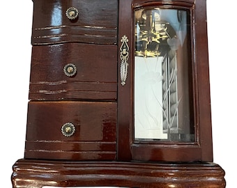 I love the 80s! Vintage Jewelry Armoire with Built-in Music Box. It has 3 Drawers and a Glass Side Cabinet. Plays &quot;Love Me Tender&quot;.