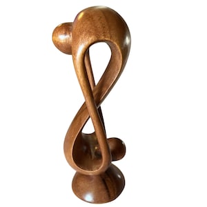 Handcrafted Wooden Figurine Depicting an Abstract Couple Embracing, referred to as &quot;Infinity love Sculpture&quot;.