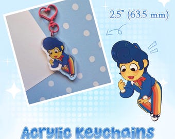 May include: An acrylic keychain featuring a cartoon character with blue hair, a blue jacket, and rainbow-striped pants. The keychain has a pink heart-shaped clasp and measures 2.5 inches. The text Acrylic Keychains is displayed below.
