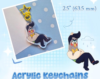 May include: An acrylic keychain measuring 2.5 inches, featuring a cartoon character with dark hair, a yellow bowtie, and a cream-colored shirt, sitting with arms crossed. The keychain includes a yellow star-shaped clasp and is labeled Acrylic Keychains.