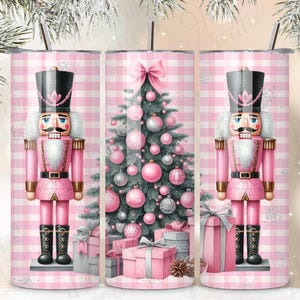 May include: Three pink and white checkered stainless steel tumblers with a pink Christmas tree, pink presents, and a pink nutcracker design.
