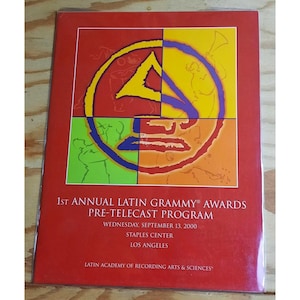 May include: A red, yellow, green, and blue program for the 1st Annual Latin Grammy Awards Pre-Telecast Program. The program is dated Wednesday, September 13, 2000 and states that the event took place at the Staples Center in Los Angeles. The Latin Academy of Recording Arts & Sciences is listed as the host.
