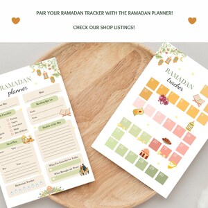 May include: Two printable Ramadan planner and tracker sheets with a light brown wood background. The planner sheet has a checklist for daily activities, a meal plan, and space to write about what you are grateful for and what brought you peace. The tracker sheet has 30 boxes with different Ramadan symbols, such as a mosque, a lantern, and dates.