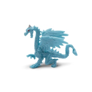 May include: A light blue plastic dragon figurine with red eyes and a horn. The dragon has detailed wings and a long tail. The figurine is posed in a walking stance, with its mouth open. The dragon is a fantasy-themed collectible.