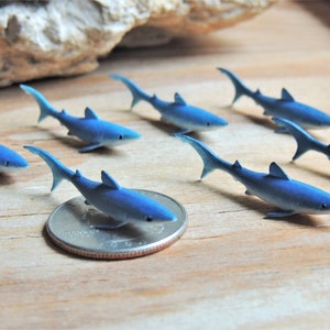 Tiny Blue Shark miniature animal mini-figures for crafts, dollhouses, terrarium supplies, fairy garden minis, dioramas, resin projects, soap slime filler, party favors, shark week parties, counting games, game pieces, scavenger hunts, jewelry making.
