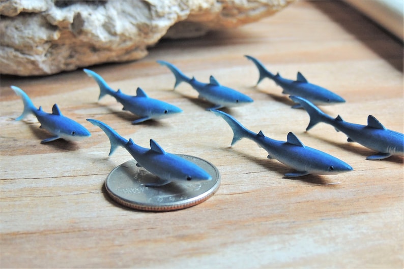 Tiny Blue Shark miniature animal mini-figures for crafts, dollhouses, terrarium supplies, fairy garden minis, dioramas, resin projects, soap slime filler, party favors, shark week parties, counting games, game pieces, scavenger hunts, jewelry making.