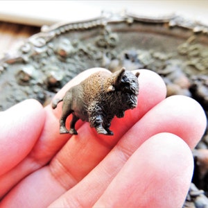 Set of tiny miniature realistic soft collectible bison for crafts, dollhouses, terrariums, fairy or zen gardens, dioramas, shadow boxes, sensory or pretend play, plant pets, and much more.