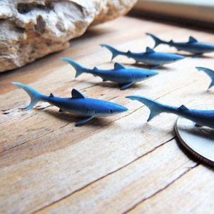 Tiny Blue Shark miniature animal mini-figures for crafts, dollhouses, terrarium supplies, fairy garden minis, dioramas, resin projects, soap slime filler, party favors, shark week parties, counting games, game pieces, scavenger hunts, jewelry making.