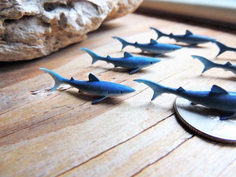 Tiny Blue Shark miniature animal mini-figures for crafts, dollhouses, terrarium supplies, fairy garden minis, dioramas, resin projects, soap slime filler, party favors, shark week parties, counting games, game pieces, scavenger hunts, jewelry making.