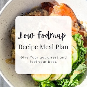 May include: A white bowl with a green salad, cucumber slices, salmon, and a creamy dressing. The bowl is on a gray wooden surface. The text "Low fodmap Recipe Meal Plan Give Your gut a rest and feel your best." is on a white rectangle in the center of the image. The text "NUTRAVIE ACADEMY" is at the bottom of the image.
