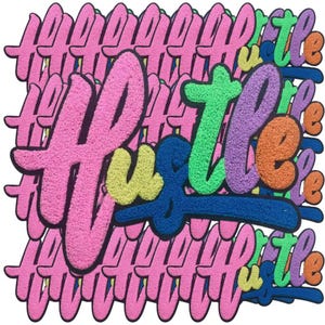 May include: A stack of colorful felt patches with the word "Hustle" written in a bold, stylized font. The patches are in shades of pink, blue, green, yellow, and orange.