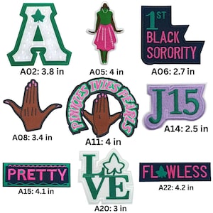 May include: A collection of embroidered patches in various shapes and designs. Includes a large white letter "A" with green trim, a figure in a green top and pink skirt, and patches with text like "PRETTY" and "FLAWLESS". Sizes range from 2.5 to 4.2 inches.