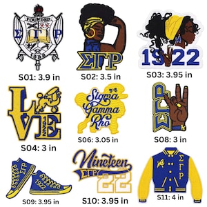 May include: A collection of embroidered patches featuring Greek letters, symbols, and phrases. Designs include a crest, a woman with a head wrap, the numbers 1922, a hand gesture, sneakers, and a letterman jacket. Sizes range from 3 to 4 inches.