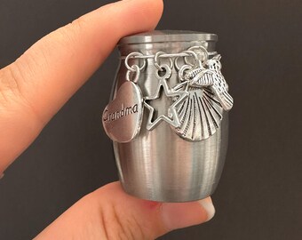 Miniature Cremation Ashes Holder Urn with Grandma Star Seashell and Hummingbird Charms Heavyweight Stainless Steel