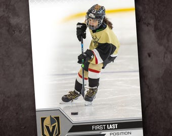 May include: A hockey player wearing a gold and black jersey with a black helmet and a black and white stick. The player is on the ice with a puck in front of them. The image is a hockey card with the team logo and the player's name and position.