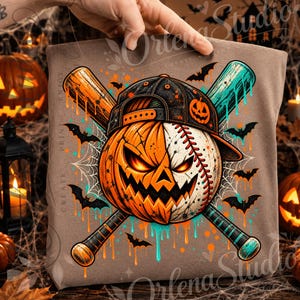 May include: A brown t-shirt featuring a graphic of a baseball that is half-pumpkin with a carved face and half-baseball with red stitching. The baseball wears a black cap with a pumpkin icon, crossed by orange and teal baseball bats.