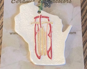 One of a Kind Ornament! Wisconsin state shaped ornament features old fashioned sled. Handmade ceramic! Arrives neatly gift bagged!