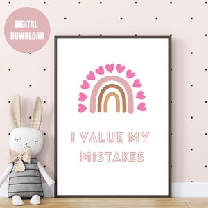May include: A printable wall art print featuring a pink rainbow and pink hearts. The text "I value my mistakes" is written in pink below the rainbow.