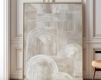 May include: Abstract art print featuring a beige and white design with curved and rectangular shapes. The artwork is framed in a gold-colored frame and is displayed against a white wall. The art piece adds a modern touch to any interior space.