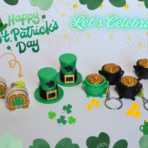 May include: St. Patrick's Day themed decorations, including green top hats, pots of gold, and lucky charm keychains. The image also features the text "Happy St. Patrick's Day" and "Let's Celebrate".