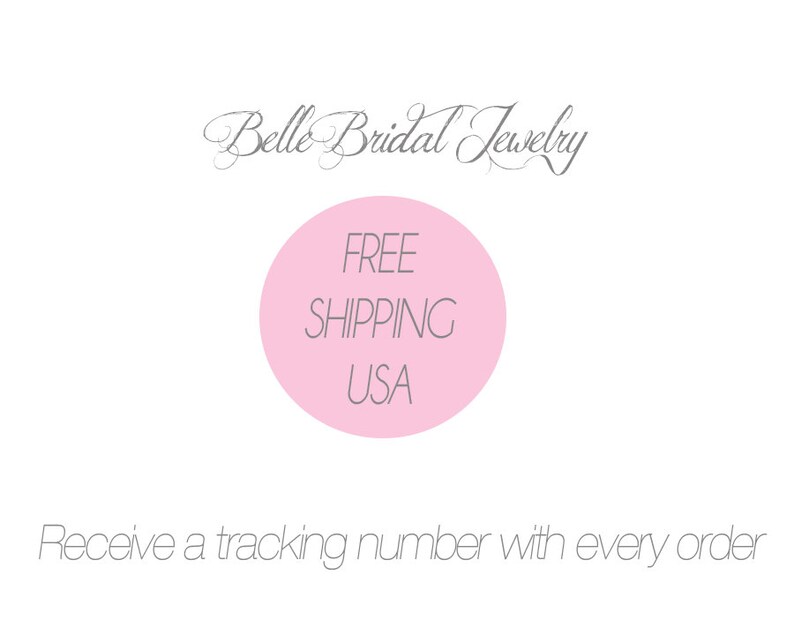 May include: A pink circle with the text "FREE SHIPPING USA" in gray text. Below the circle is the text "Receive a tracking number with every order".