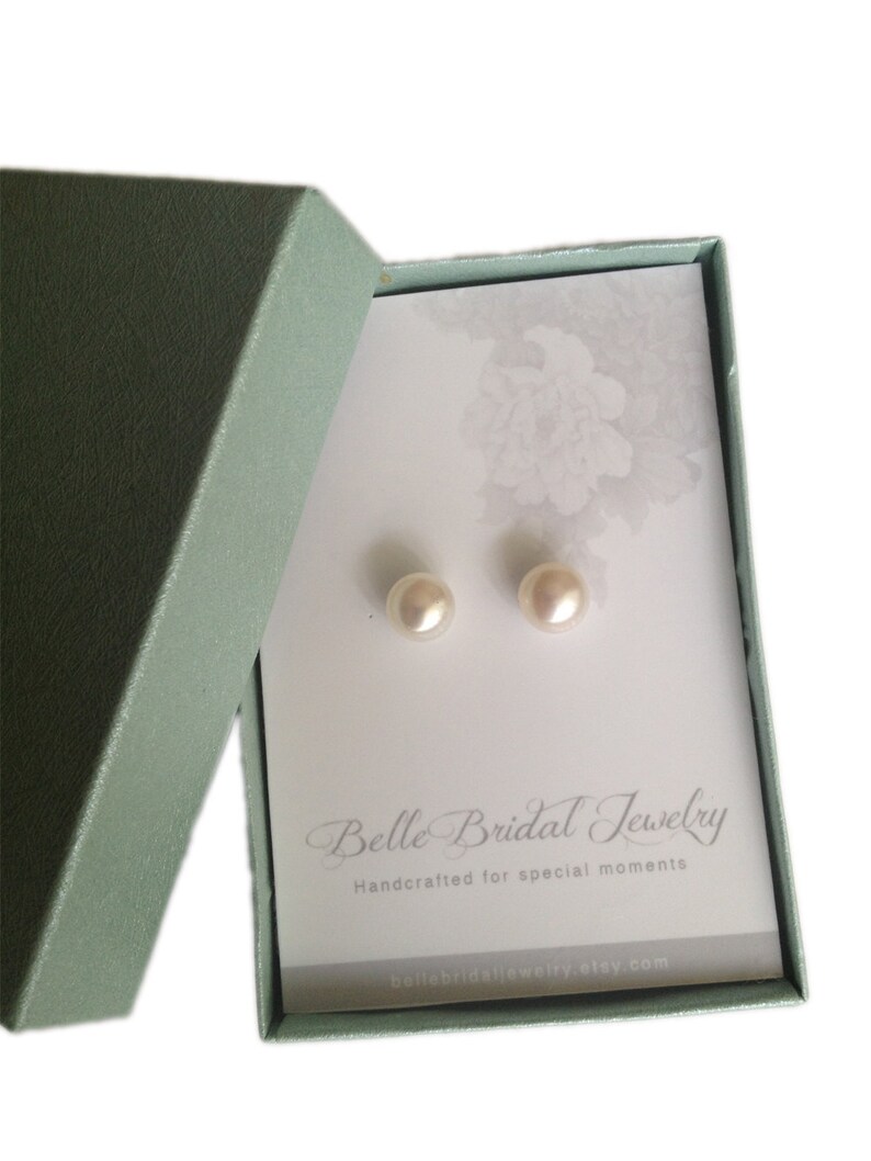 May include: A pair of pearl earrings in a light green box with a white card that reads "Belle Bridal Jewelry Handcrafted for special moments bellebridaljewelry.etsy.com"