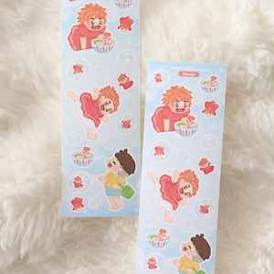 May include: Two sticker sheets with illustrations of characters from the animated film "Ponyo." The stickers have a light blue background with bubbles and small red and white decorative elements. The characters are depicted in various poses.