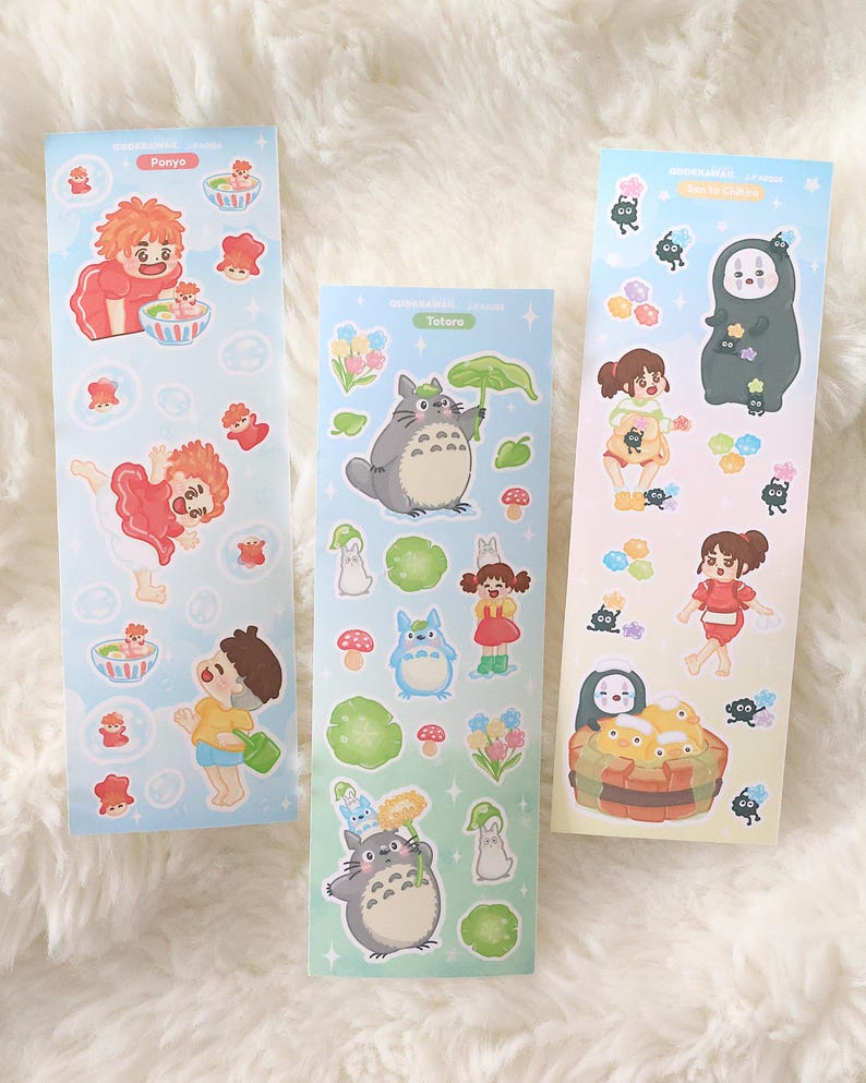 May include: Three sticker sheets with characters from animated films. The stickers feature characters from "Ponyo", "My Neighbour Totoro", and "Spirited Away". The stickers are colourful and feature various characters and objects from the films.