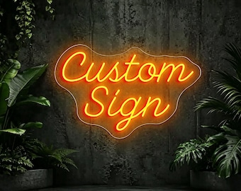May include: A neon sign with orange glowing script text that reads Custom Sign, mounted on a dark gray textured wall. The sign features a wavy, irregular outline that follows the shape of the illuminated lettering.