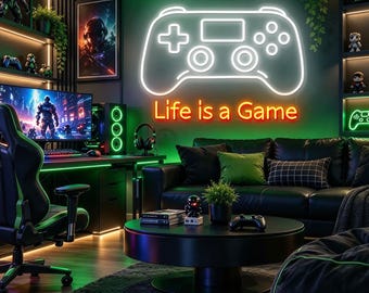 May include: A white neon sign shaped like a game controller mounted on a green wall above a black leather sofa. Below the controller, an orange neon sign displays the text Life is a Game. The room features gaming equipment and decor.