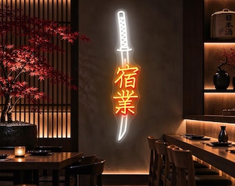 May include: A vertical neon sign shaped like a katana sword with a white glowing outline and the Japanese kanji characters 宿業 illuminated in bright orange light, mounted on a dark wall in a dimly lit interior space.