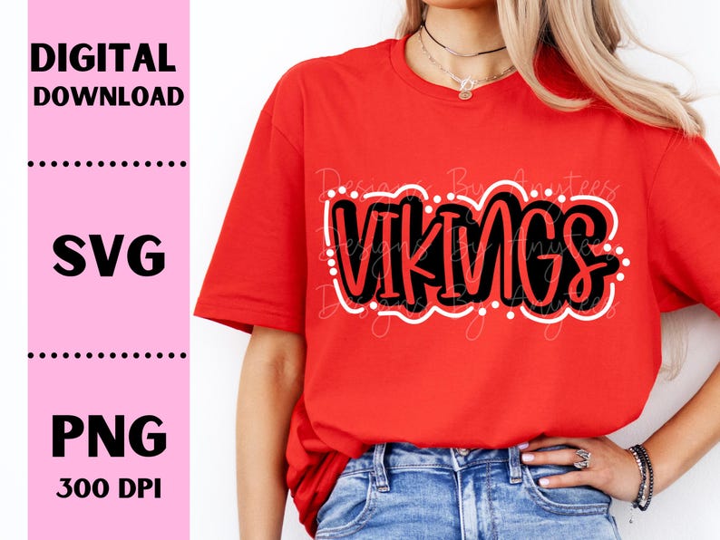 May include: A red t-shirt with the word "VIKINGS" in black outlined in white. The shirt is being worn by a person with long blonde hair.