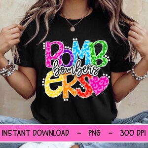 May include: Black t-shirt with the text "BOMB BOMBERS ERS" in a colorful, leopard print design. The shirt also includes the text "INSTANT DOWNLOAD - PNG - 300 DPI".