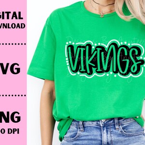 May include: A green t-shirt with the word "VIKINGS" in black and white lettering. The lettering is in a bubble style font with white outlines and black fill.