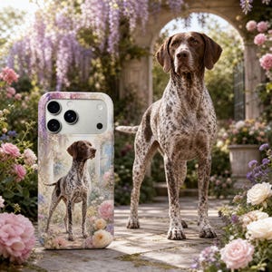 May include: A German Shorthaired Pointer dog stands in a garden with a matching phone case. The phone case features the same dog breed in a floral setting. The dog has a brown head and spots on its white and brown body. The garden has pink and purple flowers.